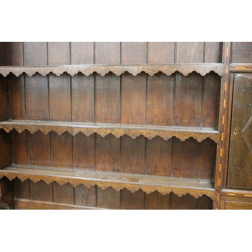 151 - Antique 18th century revival inlaid oak dresser, the enclosed three tier plate rack with cupboards o... 