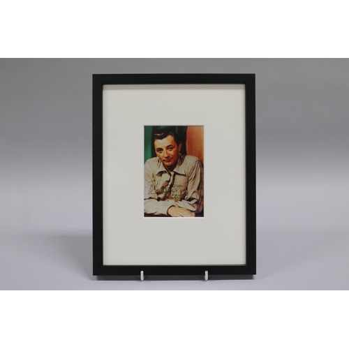 192 - Robert Charles Durman Mitchum (August 6, 1917 - July 1, 1997) Signed colour photograph. He was an Am... 