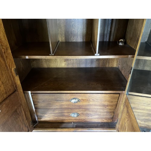 88 - Oak wardrobe with panel doors brass fitting pidgeon hole and drawer interior, approx 188cm H x 113cm... 