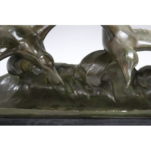 224 - Louis Sosson (-) France, bronze sculpture of two seagulls riding a wave, on marble base, approx 27cm... 