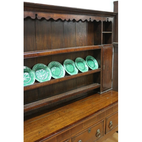 227 - Antique late 18th century oak and mahogany cross banded three drawer dresser, the open central shelf... 