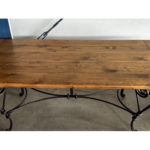 25 - Good quality long oak topped dining table, with hand forged elaborate wrought iron base, approx 78cm... 