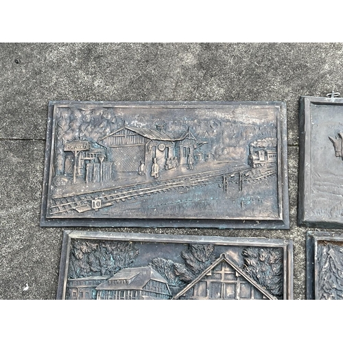 44 - Four cast bronze plaques (4), approx 53cm L x 29cm H & smaller