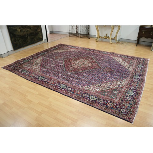 231 - Large Persian carpet of mostly red ground, approx 293cm x 370cm