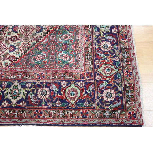 231 - Large Persian carpet of mostly red ground, approx 293cm x 370cm