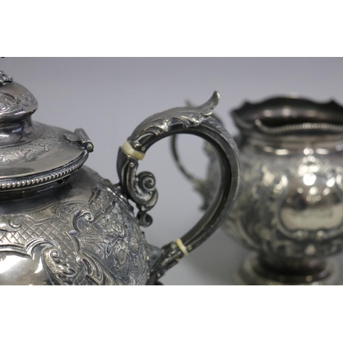 2 - Antique mid Victorian sterling silver three piece tea service, comprising a teapot, open sugar, and ... 
