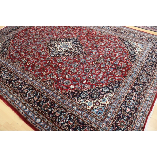 284 - Large Persian handmade Kashah carpet of red ground, approx 298cm x 378cm