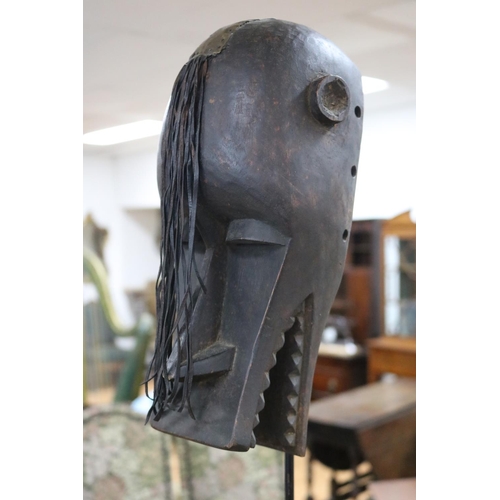 301 - Carved wood African mask on stand, approx 31cm H (ex stand)