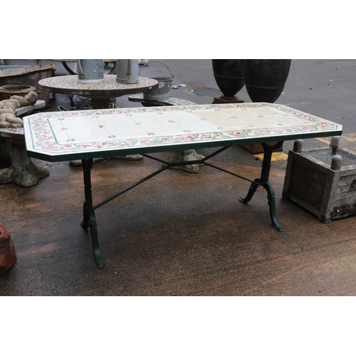 266 - Large French cast iron base bistro table with hand painted Fushsia tiles to top, signed 