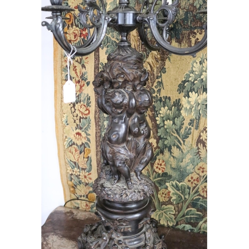 240 - Most impressive large pair of French figural putti candelabras, five lights to each, unknown working... 