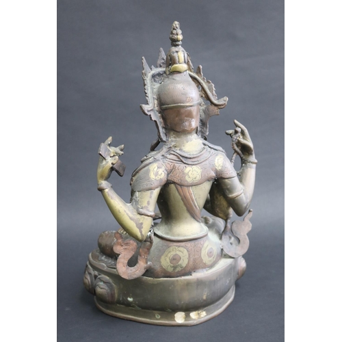 317 - Tibetan bronze Buddhist Deity (Four-Armed Avalokiteshvara) well cast in sections, seated on a single... 