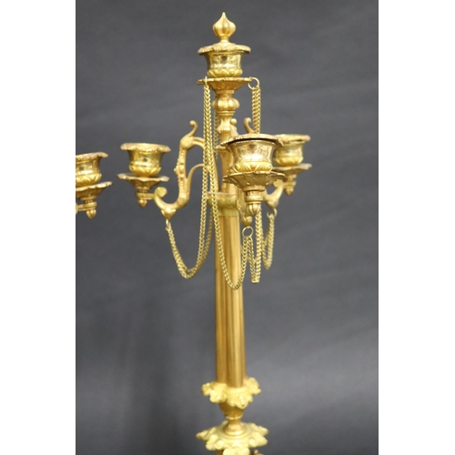 101 - Pair of French fine quality gilt brass four stick candelabras, with applied drop chains, each approx... 