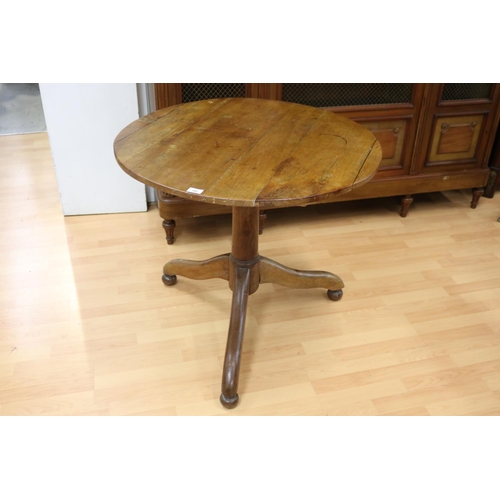 102 - Antique early 19th century French rustic cherrywood circular pedestal table, with folding flaps, app... 