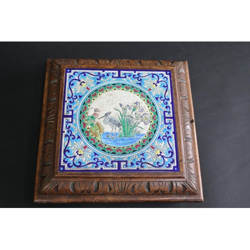 123 - Antique French carved oak and majolica tile table plateau, with service bell action, approx 6cm H x ... 