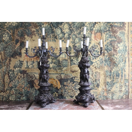 240 - Most impressive large pair of French figural putti candelabras, five lights to each, unknown working... 