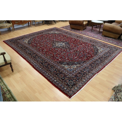 284 - Large Persian handmade Kashah carpet of red ground, approx 298cm x 378cm