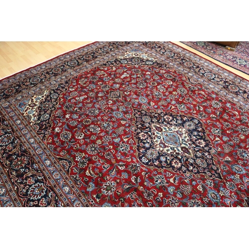 284 - Large Persian handmade Kashah carpet of red ground, approx 298cm x 378cm