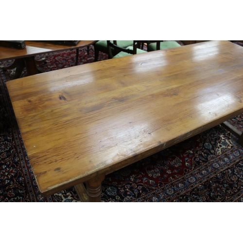 287 - English oak slab top period revival trestle table, with central long stretcher, held by turned block... 