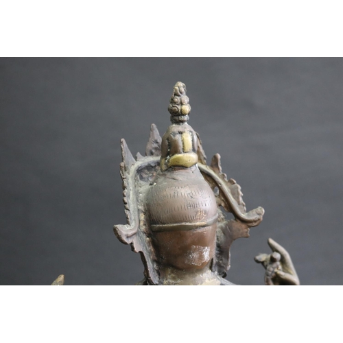 317 - Tibetan bronze Buddhist Deity (Four-Armed Avalokiteshvara) well cast in sections, seated on a single... 