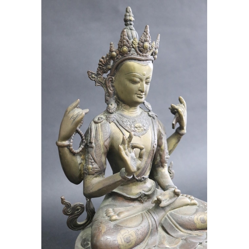 317 - Tibetan bronze Buddhist Deity (Four-Armed Avalokiteshvara) well cast in sections, seated on a single... 