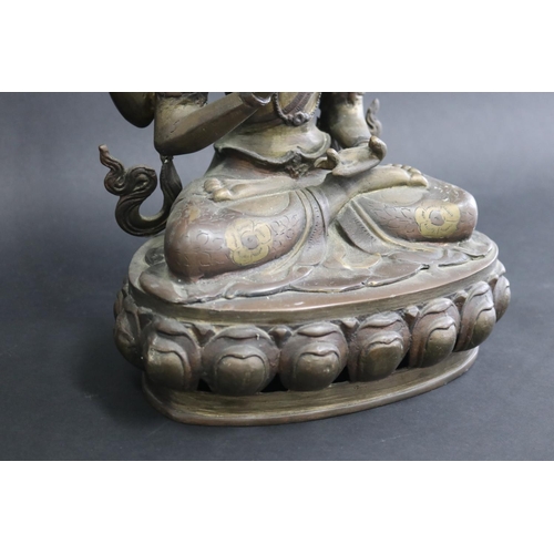 317 - Tibetan bronze Buddhist Deity (Four-Armed Avalokiteshvara) well cast in sections, seated on a single... 