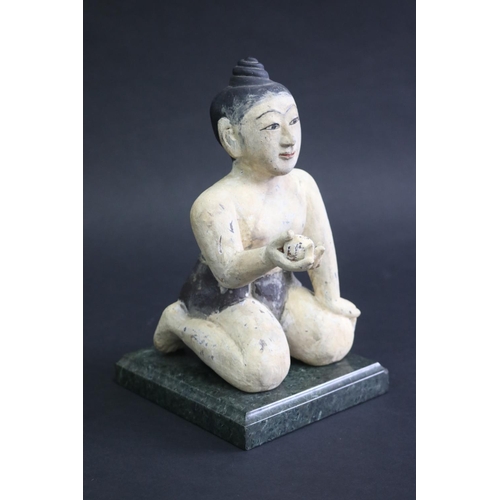 340 - South East Asian carved painted wood seated figure on marble base, approx 21cm H (ex base)