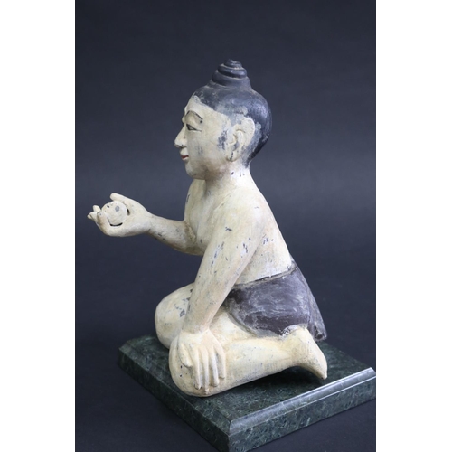 340 - South East Asian carved painted wood seated figure on marble base, approx 21cm H (ex base)