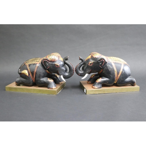 342 - Pair of carved wood & painted elephants on brass stands, each approx 18cm H x 27cm W x 15cm D (2)