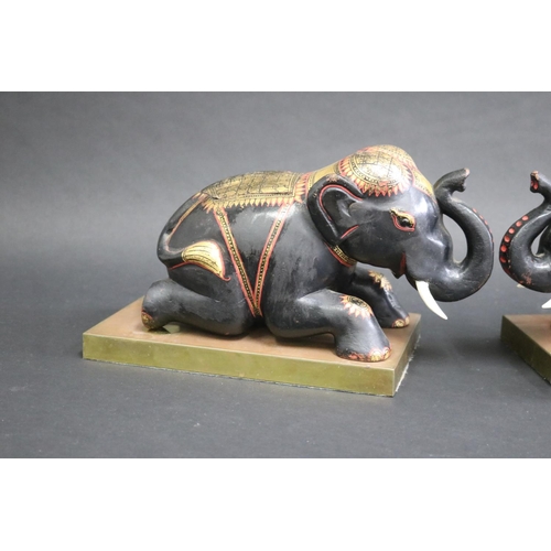 342 - Pair of carved wood & painted elephants on brass stands, each approx 18cm H x 27cm W x 15cm D (2)