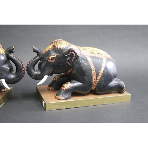 342 - Pair of carved wood & painted elephants on brass stands, each approx 18cm H x 27cm W x 15cm D (2)