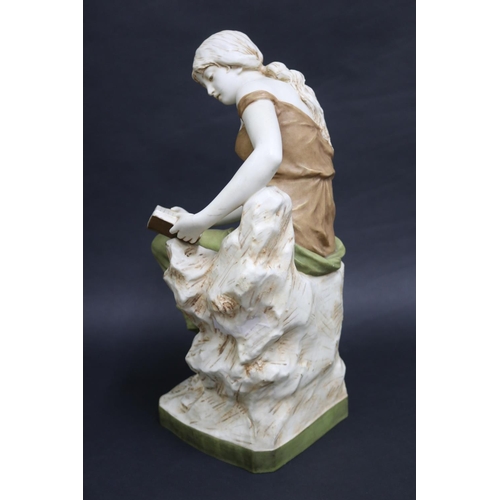 38 - Large Antique Royal Dux porcelain figure of a semi clad female reading a book, with pink triangle lo... 