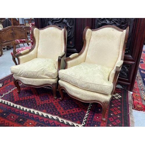 321 - Pair of French Louis XV style wingback armchairs (2)