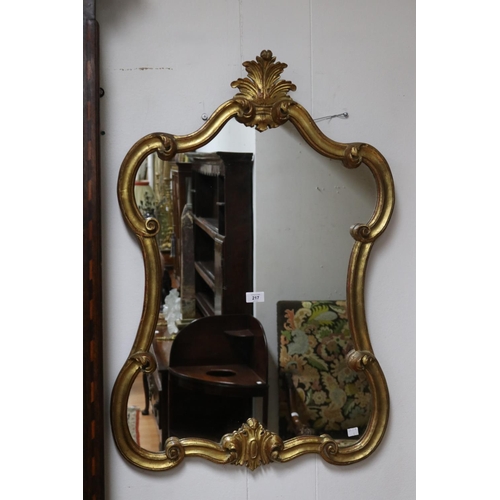 217 - Antique style waisted shape gilt surround mirror, approx 90cm H x 61cm W