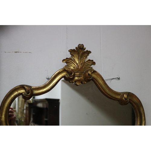 217 - Antique style waisted shape gilt surround mirror, approx 90cm H x 61cm W