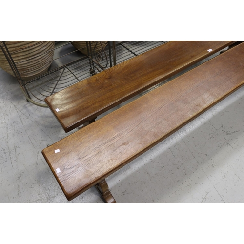 176 - Pair of French oak long trestle support benches, each approx 46cm H x 220cm L (2)