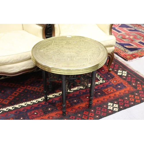 352 - Middle Eastern brass tray top circular coffee table, on fold out base, approx 53cm H x 60cm Dia