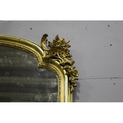 251 - Fine and large antique French gilt mantle mirror with shaped top & decoration, approx 178cm x 108cm