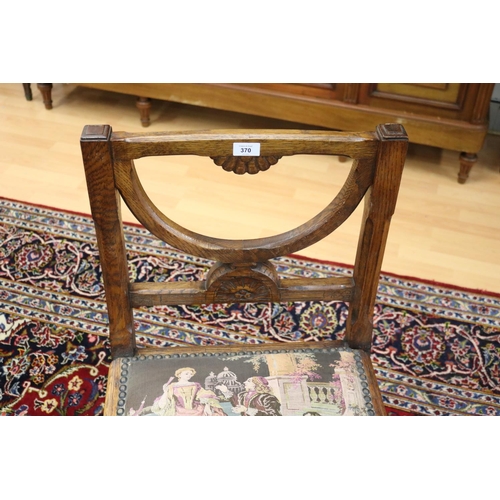 370 - Antique French X frame carved oak hall chair with needlework seat, central central mask head, and li... 