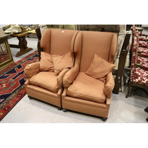 380 - Pair of wingback armchairs on castors with three cushions (2)