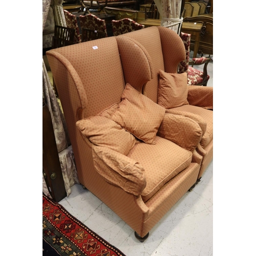 380 - Pair of wingback armchairs on castors with three cushions (2)