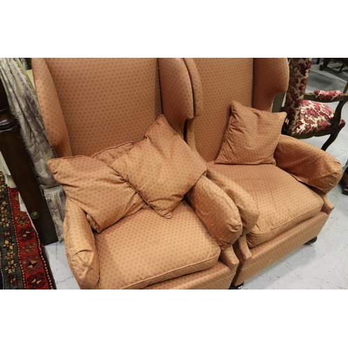 380 - Pair of wingback armchairs on castors with three cushions (2)