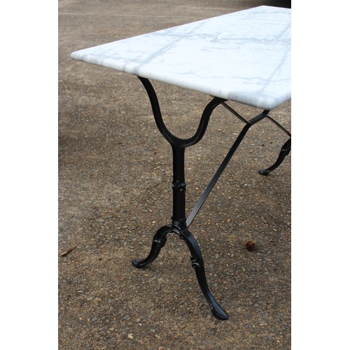 298 - French marble topped bistro table with iron frame, approx 71cm H x 100cm W x 60cm D