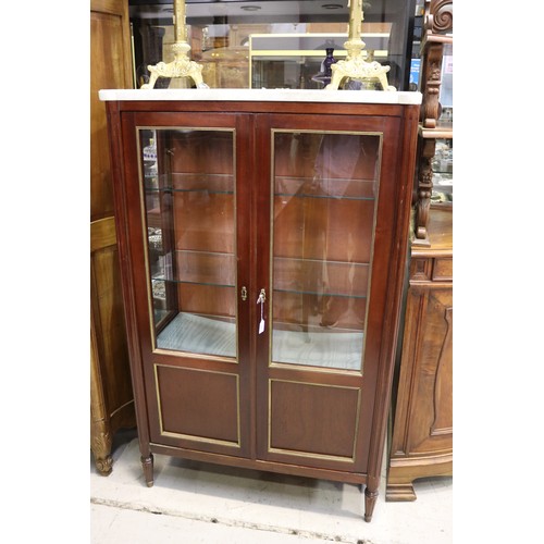 129 - French Louis XVI style two door showcase, with white marble top, and brass mounted trim, approx 145c... 