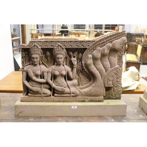 388 - South East Asian carved stone figural Sculpture with female figures in high relief. Buff stone stand... 