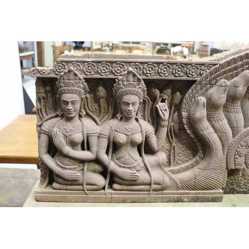 388 - South East Asian carved stone figural Sculpture with female figures in high relief. Buff stone stand... 