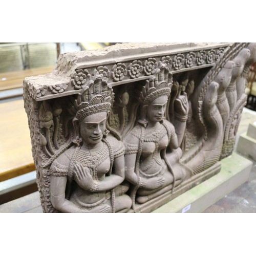 388 - South East Asian carved stone figural Sculpture with female figures in high relief. Buff stone stand... 