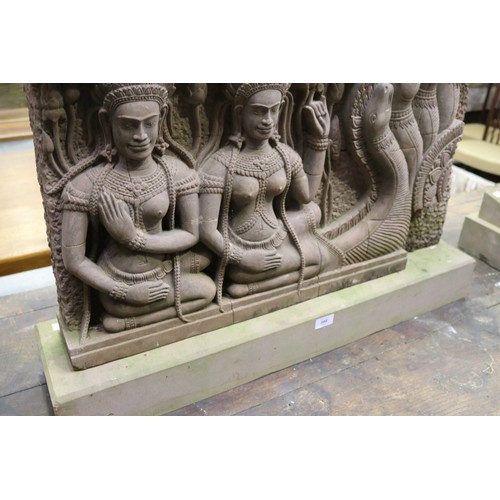 388 - South East Asian carved stone figural Sculpture with female figures in high relief. Buff stone stand... 