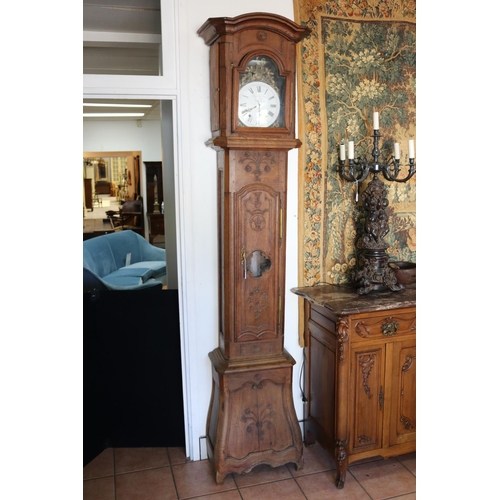 237 - Antique French Louis XV style bombe longcase clock carved in low relief, with movement, has key (in ... 