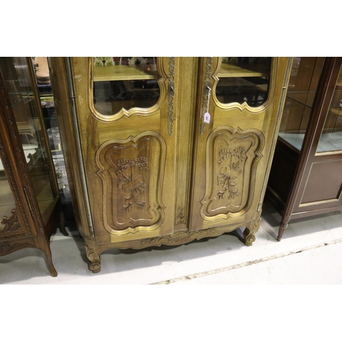 486 - Modern French Louis XV style two door bookcase, with carved palled doors below, approx 193cm H x 125... 