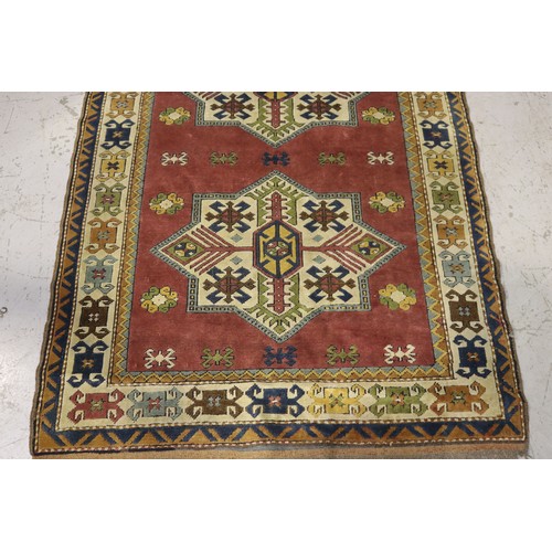 527 - Hand knotted wool carpet, approx 182cm x 126cm